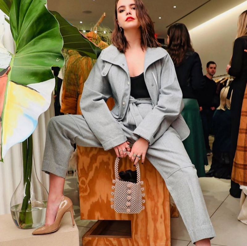 Bailee Madison carries the 'Ravelo' bag to the Phillip Lim fashion show in New York City